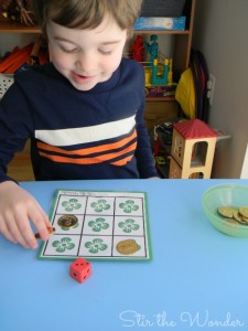 Playing St. Patrick's Day Shamrock Grid Math Game | Stir the Wonder