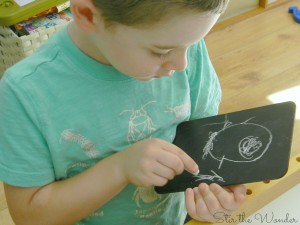 drawing with chalk on small chalkboards is a simple fine motor activity for preschoolers