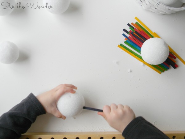 Building snowball sculptures with craft sticks
