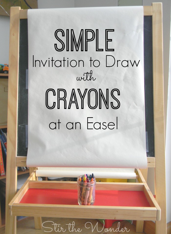 Set up a simple invitation to draw with crayons at an art easel for a fun open-ended process art activity!