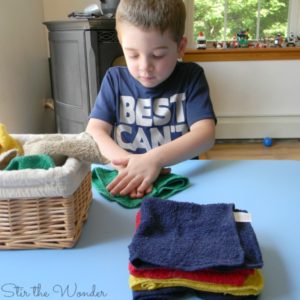 Child folding towels